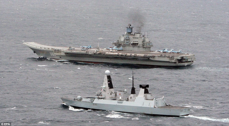 The bear in our backyard: Return of the Cold War as Royal Navy confronts Russian aircraft carrier group in the English Channel for the first time in years