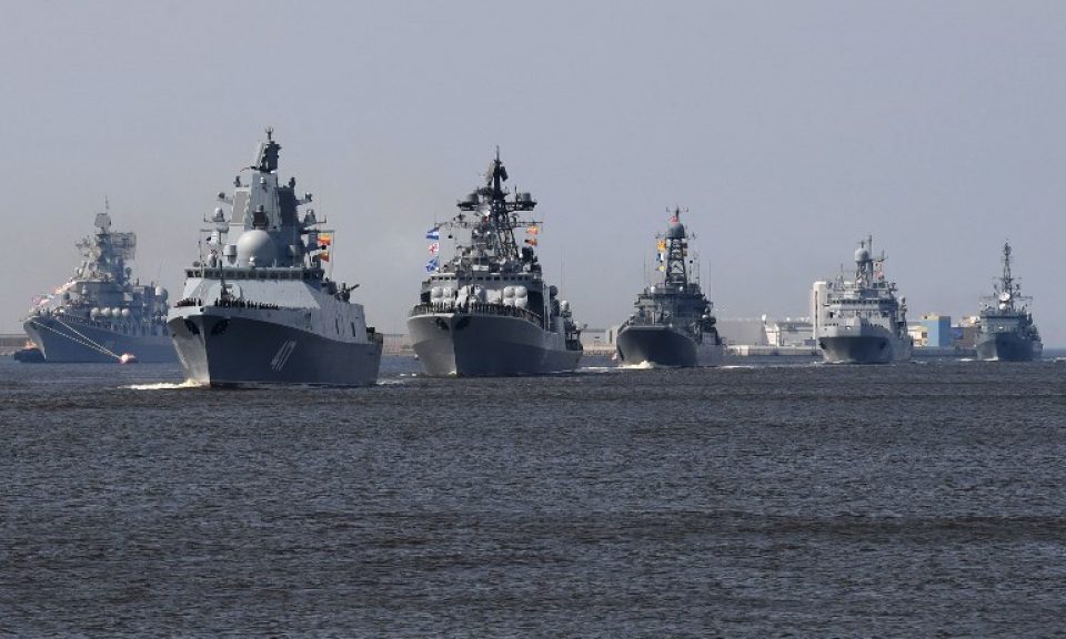Russian warships, among them the frigate Admiral Gorshkov (second left), sail near Kronshtadt naval base outside St Petersburg on July 20, 2018, during a rehearsal for the Naval Parade. Photo: AFP / Olga Maltseva